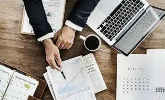 Accountant reviewing financial reports and tax documents